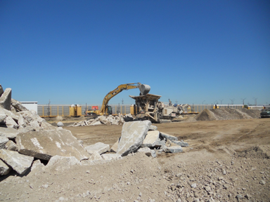 An extruder digs on the jobsite for Chrystler Belvidere.