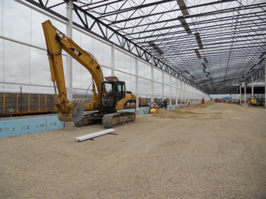 An extruder digs on the jobsite for Chrystler Belvidere.